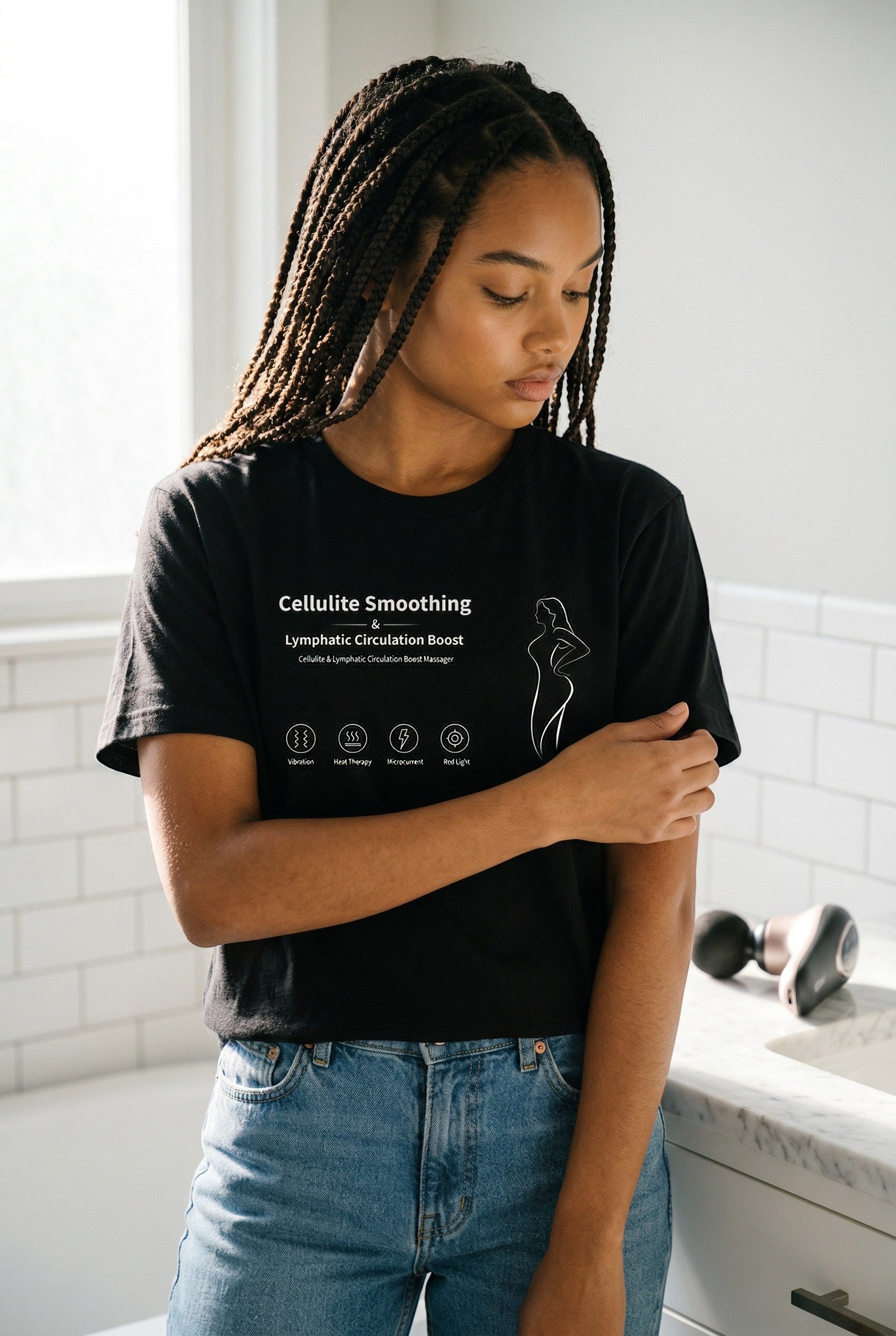 Exquisite Deal Shop black t-shirt with cellulite smoothing and lymphatic circulation boost graphic. Includes icons for vibration, heat therapy, microcurrent, and red light.