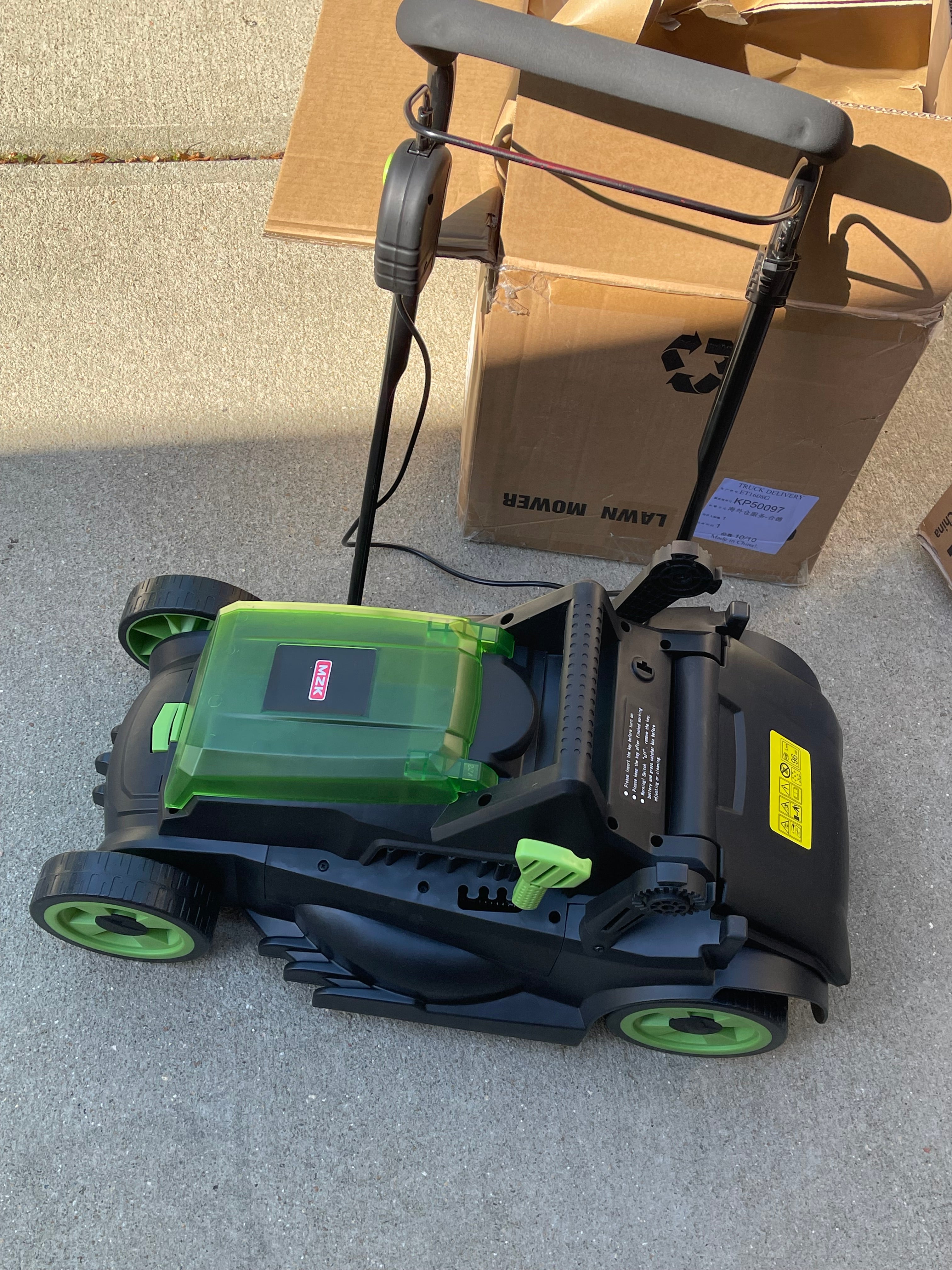 Check electric lawn mower