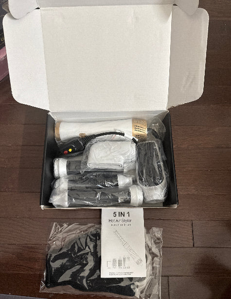 This 5-in-1 multi-styler combines a hair dryer, brush, comb, and curling iron