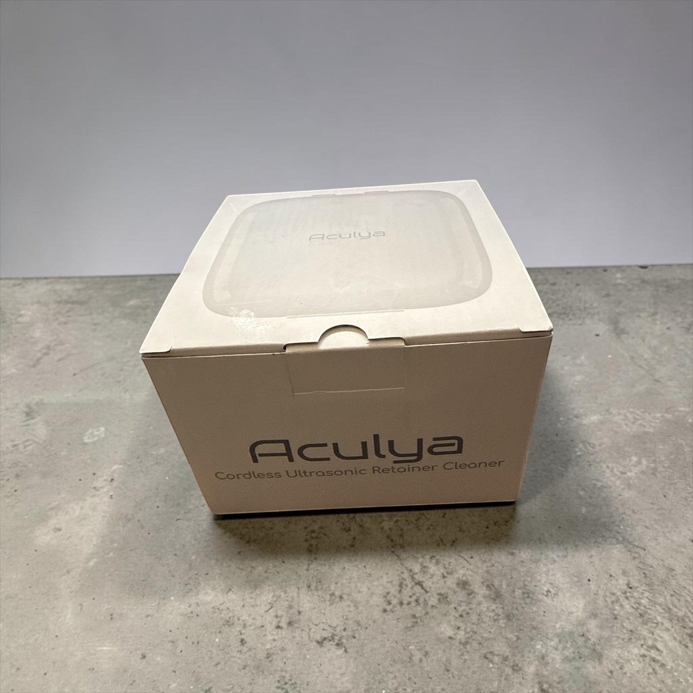 Exquisite Deal Shop white cordless ultrasonic retainer cleaner pod with built-in mirror for aligners, night guards, and jewelry.